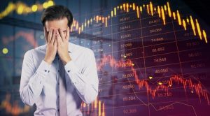 Young investor upset with the downward charts in the bakcground_id_9ecede27-e6c6-4d25-9696-8239f6056feb_size775