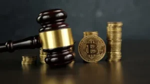 Auction-gavel-and-bitcoin-cryptocurrency-money-on-a-wooden-desk